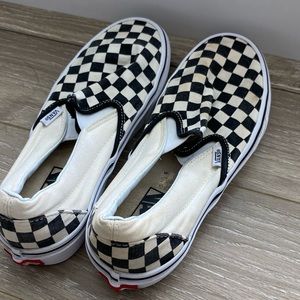 Checkered Vans slip-ons